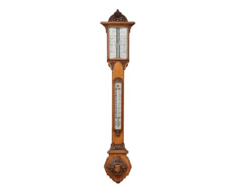 A Victorian carved oak mercury stick barometer, J.H Steward, London, third quarter 19th century, with foliate scroll carved a