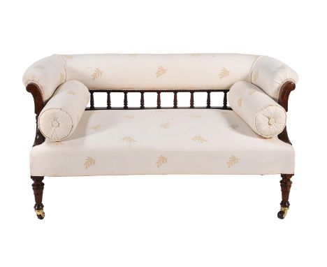 Y A late Victorian rosewood two-seater sofa, circa 1900, of tub form, the back above spindle supports, and with twin bolster 