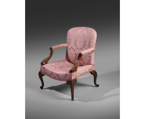 A FINE EARLY GEORGE III MAHOGANY LIBRARY ARMCHAIR POSSIBLY IRISH, CHIPPENDALE PERIOD, C.1760 the arched back above slightly s