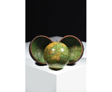A GEORGE III TERRESTRIAL POCKET GLOBE BY DOLLOND, LONDON, DATED '1809' the twelve hand-coloured gores overlaid with a Dollond