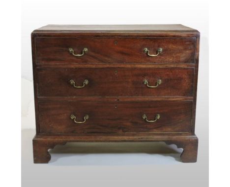 A George III mahogany chest, containing three long graduated drawers, on bracket feet, 106cm
