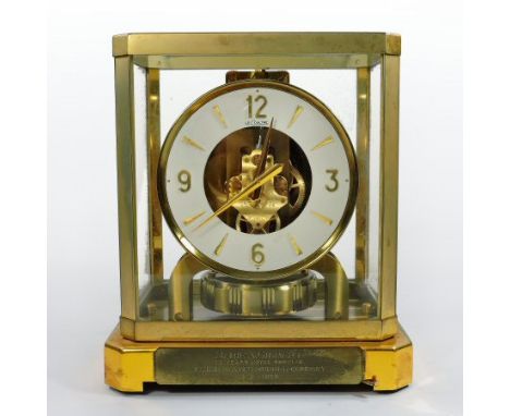 A 1960's Jaeger Le Coultre Atmos clock, contained in a glazed case with presentation plaque dedicated to 'Marie A. Gilbert, f