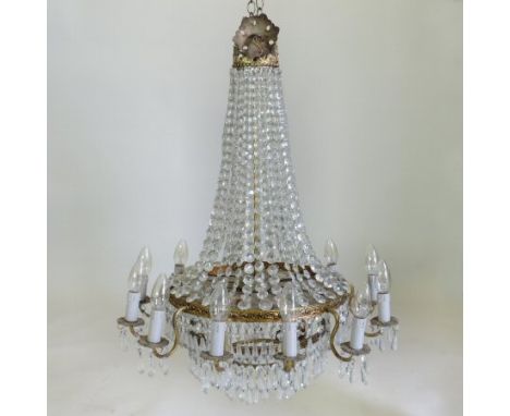 A twelve branch gilt metal and cut crystal chandelier, 84cm