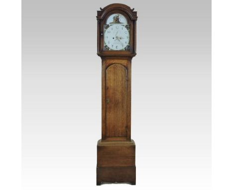 A late George III oak cased longcase clock, the arched painted dial with Arabic hours, signed R. Ulph, Stalham, the twin trai