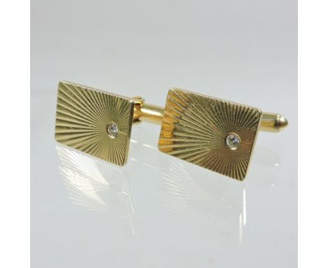 A pair of 14 carat gold and diamond set gentlemen's cufflinks, of rectangular shape with engine turned decoration