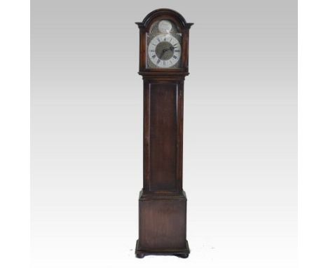 A 1930's oak cased longcase clock, having a brass dial and three train movement, with Westminster chimes, 189cm tall