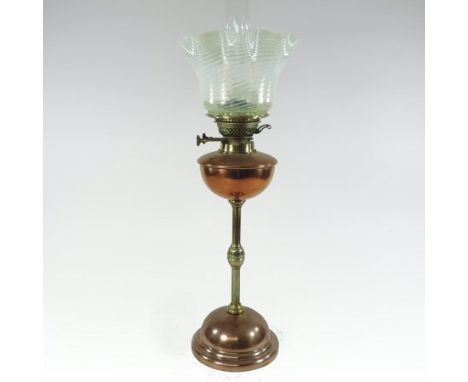 An Arts and Crafts Hinks copper and brass oil lamp, with an opalescent frilled glass shade, 59cm tall