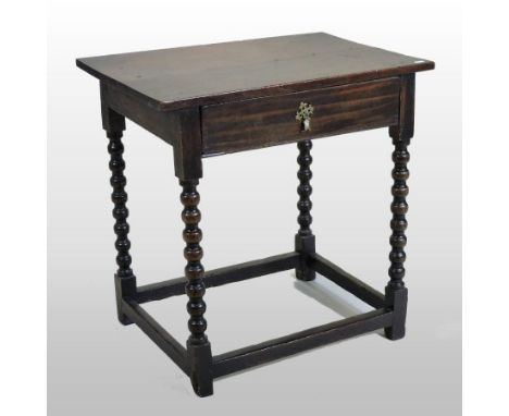 An 18th century oak side table, containing a single frieze drawer, on bobbin turned legs, 70cm