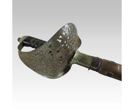 A George VI officer's sword, having a wire bound leather grip, pierced engraved hilt and an etched steel blade, in a leather 