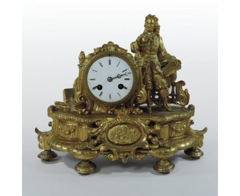 An ornate 19th century French figural gilt mantel clock, with enamel dial and eight day movement, 29cm tall