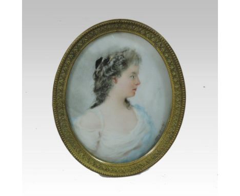 German School, early 20th century, a portrait miniature of a young lady in profile, signed Otto Merkel, in a gilt frame, 8cm 