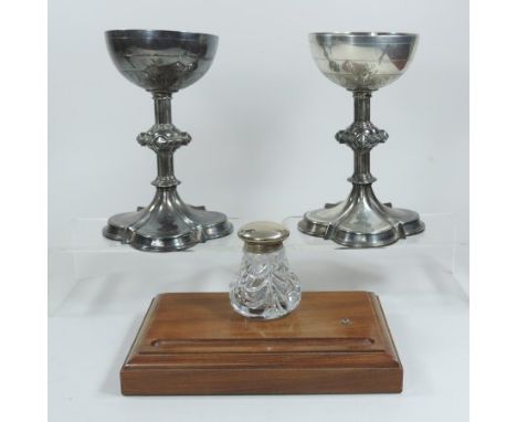 A pair of ornate 19th century silver plated chalices, each having a knopped stem, on a quatrefoil base, with engraved decorat