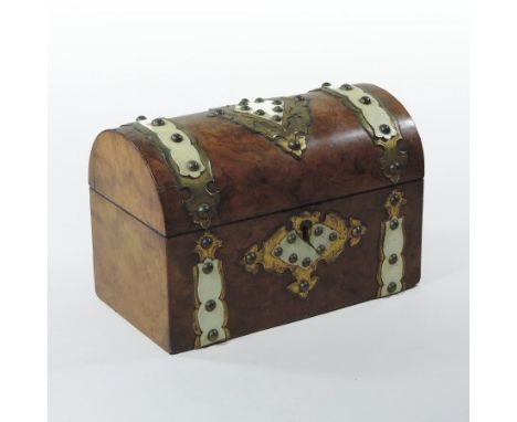 An early 19th century burr walnut, brass and ivory mounted tea caddy, in the form of a casket with a hinged lid and studded s