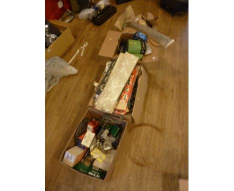 FOUR BOXES OF VINTAGE CAR PARTS, including new head gasket, steering gaiters etc