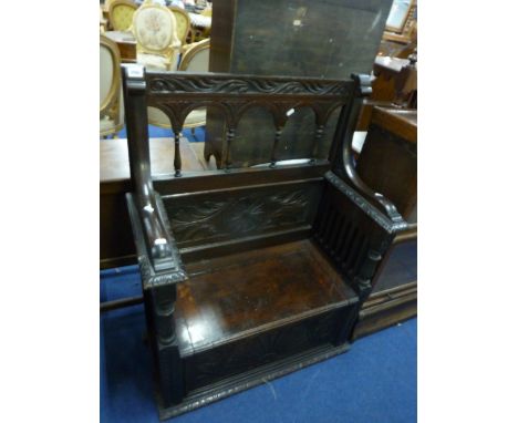 A VICTORIAN CARVED OAK MONKS BENCH, (upper section has been cut down)