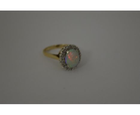 A 9CT GOLD OPAL AND DIAMOND RING, with central opal within a surround of single cut diamonds, hallmarks for Birmingham, ring 