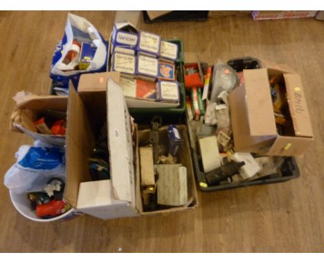 SEVEN BOXES OF VINTAGE CAR PARTS, including distributor caps etc