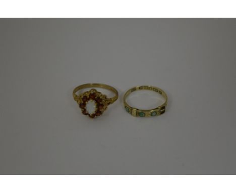 TWO 9CT GOLD RINGS, to include a belt buckle shape ring, L 1/2, together with an opal and garnet cluster ring, M, hallmarks f