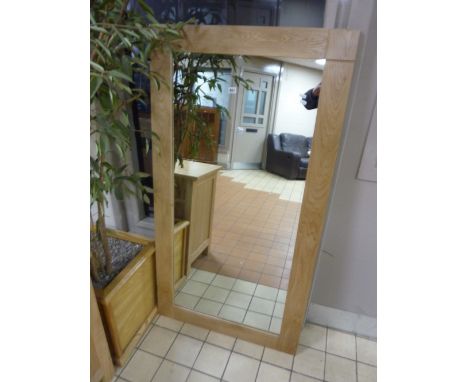 A LARGE MODERN WALL MIRROR, with light oak frame