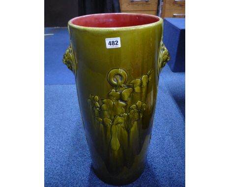 A BRETBY POTTERY STICK STAND, green glazed with lion mask handles (restored), height approximately 6cm