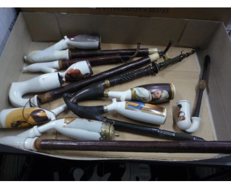 CERAMIC PIPE BOWLS, all decorated with portrait studies, all with long stem attachments, two with horn mounts in KPH style (8