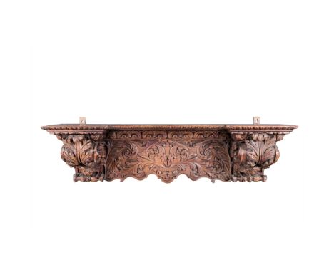 AN OAK SHELF RACK, 18TH CENTURY the moulded outswept cornice above a shaped frieze, three shelves below between square sectio