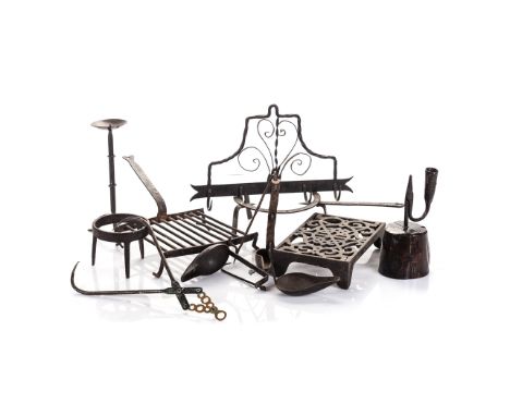 A MISCELLANEOUS GROUP OF WROUGHT IRON ITEMS, 19TH CENTURY comprising: four trivets (in various shapes and sizes), the largest