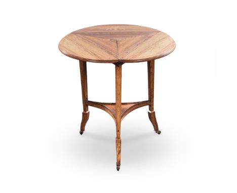 AN EDWARDIAN MAHOGANY OCCASIONAL TABLE the hinged triangular top on square section tapering supports on curved square section