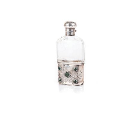 AN EDWARDIAN SILVER AND CUT-GLASS HIP FLASK, SPURRIER & CO., BIRMINGHAM, 1909 the lower half of the glass bottle fitted with 