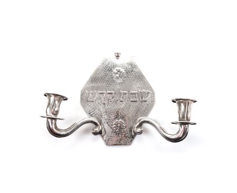 AN ELECTROPLATE SHABBAT TWO-LIGHT WALL SCONCE, 20TH CENTURY the shaped rectangular backplate moulded with two flowerheads enc