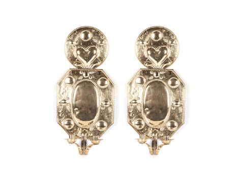 A DUTCH REPOUSSE SHEET BRASS TWO-LIGHT WALL SCONCE, LATE 18TH CENTURY with heart-shaped decoration, 60cm high, 28cm wide (2) 