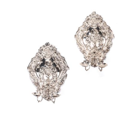 A PAIR OF SILVERED BRASS REPOUSSE TWO-LIGHT WALL SCONCES, DUTCH OR ENGLISH, 19TH CENTURY each armorial backplate centering a 