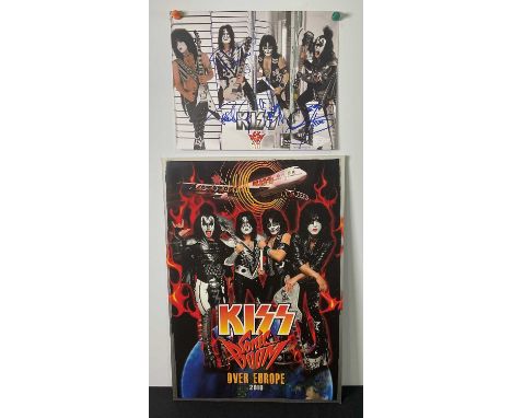 A KISS 2010 Sonic Boom tour photo card signed by band members PAUL STANLEY, GENE SIMMONS, ERIC SINGER and TOMMY THAYER, (The 