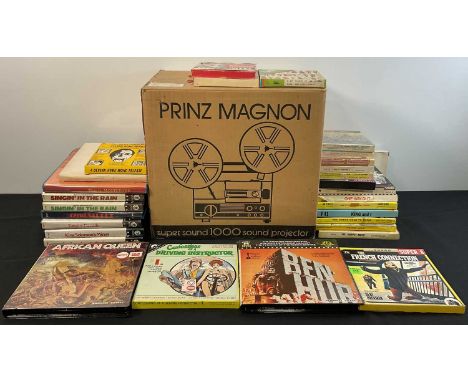 A PRINZ MAGNON SUPER SOUND 1000 Super 8 film projector, boxed in original packaging together with a quantity of Super 8 films