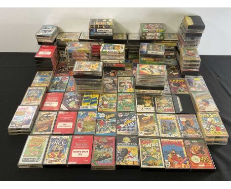 A large quantity of Atari video game cartridges, mostly from the 1980s, including CHUCKIE EGG, NINJA COMMANDO, AZTEC CHALLENG