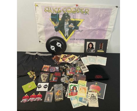 A selection of ALICE COOPER music memorabilia comprising backstage, VIP and crew tour passes, badges, stickers, key rings, po