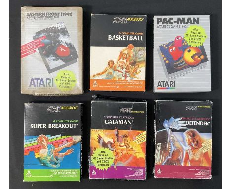 A group of 6 Atari video games all boxed with instructions comprising GALAXIAN (1982), DEFENDER (1987), PAC-MAN (1987), SUPER