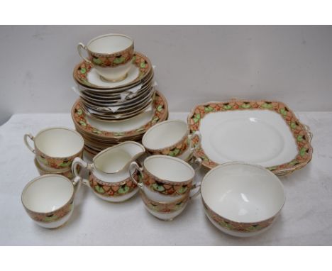 A Paragon china part tea service including cups, saucers, a jug, and side plates, cake plates/platters, banded decoration wit
