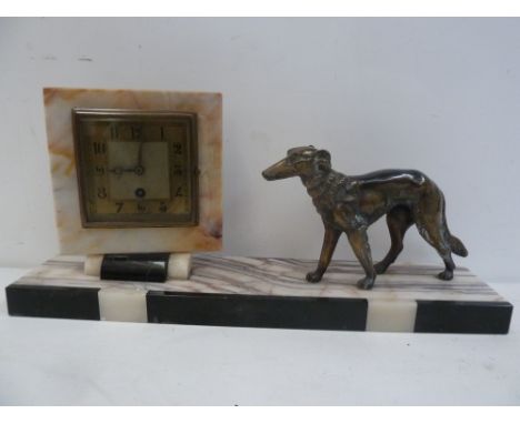 An Art Deco mantel clock, black and white marble, square brass dial with Arabic numerals, with a standing dog deside, 45cmW