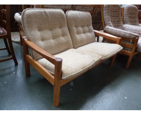 A Domino 20th century design Danish teak framed two seater sofa with oatmeal fabric