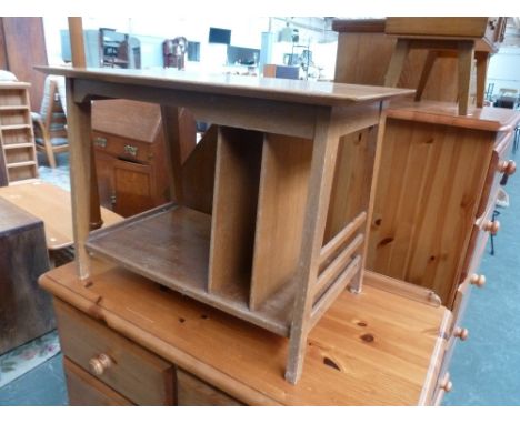 A 20th century design light oak side table with under shelf and magazine rack, square legs