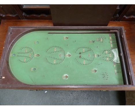 A Bagatelle board with wooden cover
