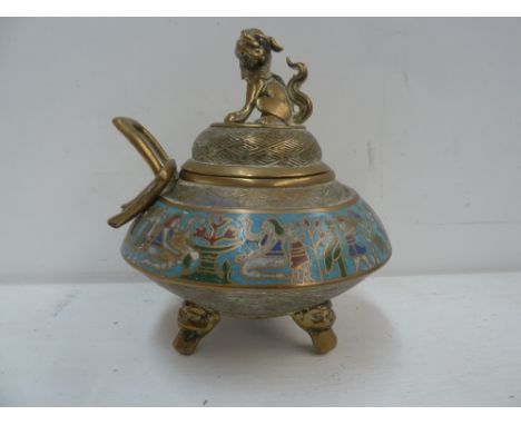 An early 20th century Chinese brass and enamel censor, decorated with Egyptian motifs, raised on tripod feet