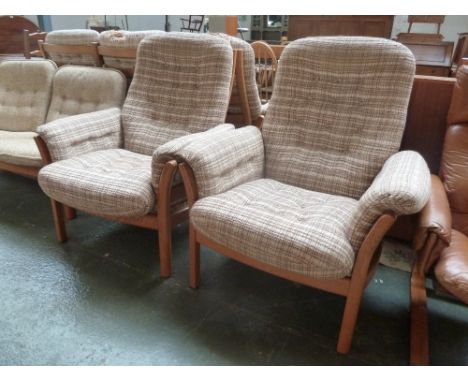 A pair of Ercol light elm button back armchairs with checkered oatmeal fabric