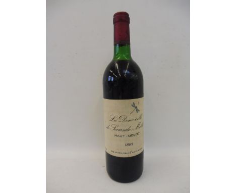 A bottle of vintage La Demoiselle de Sociando-Mallet Haut - Medoc 1987.