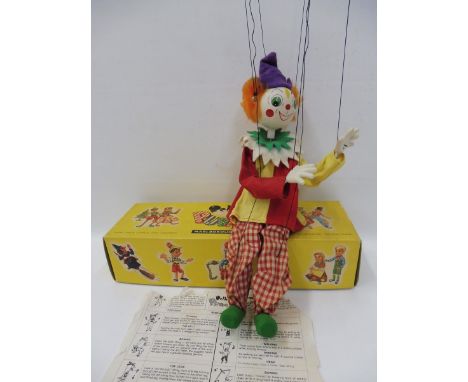 A boxed Pelham Puppet clown, 1960s in good conditon, with composite hands and instructions. 