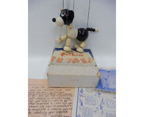 A boxed Pelham Puppet - Wuff, 1953 with original strings, controller and instructions. 