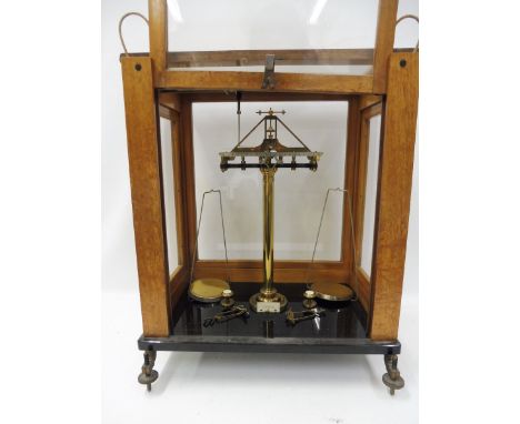 A mahogany cased set of precision scales. 