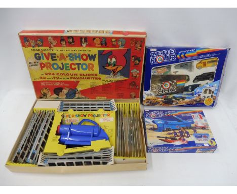 A Give-a-show projector plus two Zero Hour Bluebird action task force sets.