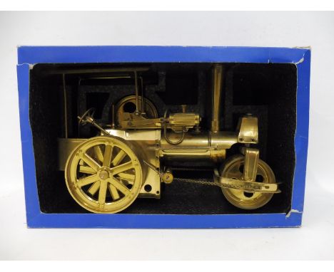 A Wilesco brass steam engine.